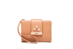 Detail of light brown PU leather clutch featuring white daisy prints and gold metal lock