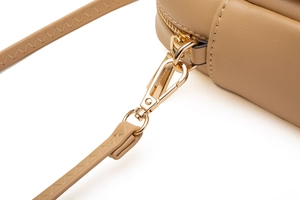 Detail of khaki leather strap with gold lobster clasp and decorative zigzag stitching
