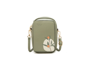 Detail of green floral phone bag with leaf prints and gold-tone metal hardware zipper
