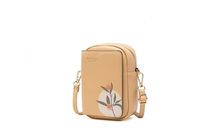 Side view detail of Prettyzys crossbody phone bag with floral print and orange buttons
