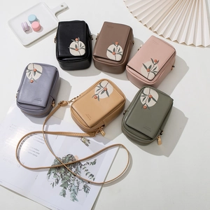 Chic women's mini crossbody phone bags in various colors with elegant botanical prints
