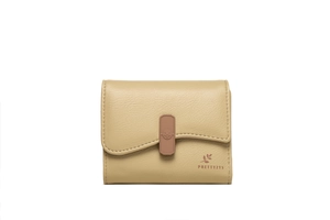 Detail of a beige pebbled leather wallet with wave flap and embossed decorative buckle