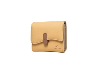 Detail of cream short bifold wallet featuring wavy flap and multi-layer card slots