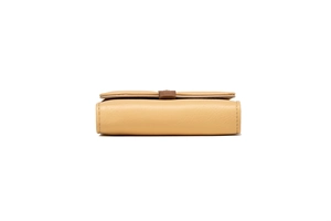 Detail shot of beige leather wallet showing precise stitching and slim tri-fold structure