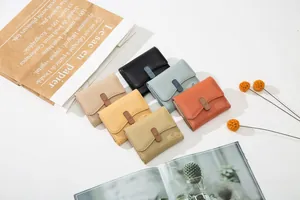 Collection of minimalist women's short wallets in six colors with stylish pebble leather finish