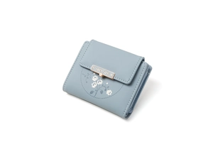 Detail view of light blue tri-fold wallet with white flower pattern and gold logo