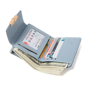Three-fold light blue leather wallet for women with gold clasp and multiple card slots