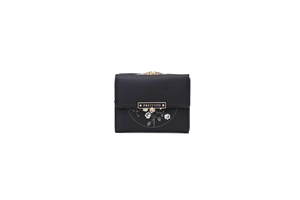 Detail of the elegant floral print and gold metal clasp on the black trifold wallet