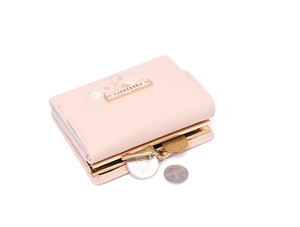 Detail view of pink PU leather trifold wallet with floral print and metal coin clasp