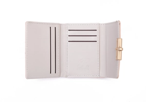 Detail of the light grey tri-fold wallet showing multiple card slots and gold snap closure