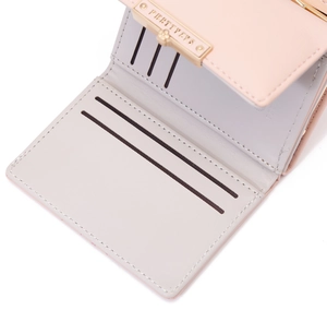 Detail of pink and gray bi-fold wallet interior with multiple card slots and metal logo