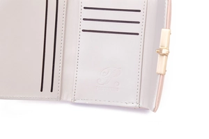 Close-up of trifold PU leather wallet interior with card slots and gold snap fastener