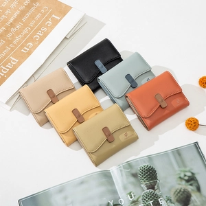 Short tri-fold women wallets in multiple colors with pebbled leather and metal buckle