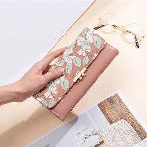 Elegant floral print trifold wallet in dusty rose PU leather with gold metal buckle