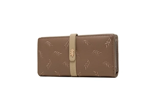 Detailed macro view of the mocha leaf-patterned long wallet with a rose gold leaf clasp