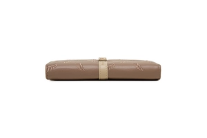 Close-up of side view showing golden leaf embroidery and stitching on brown PU purse