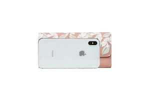 Detail of floral print tri-fold long wallet next to an iPhone for size reference