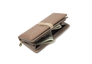 Macro view of khaki embroidered wallet with leaf metal clasp and multiple card slots