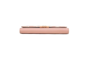 Side view detail of light pink PU leather wallet showing clean stitching and metal buckle