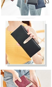 Detail view of women long wallet with wrist strap and multi-layer card holder slots