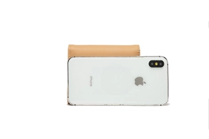 Compact tri-fold leather wallet in beige showing size comparison with a smartphone