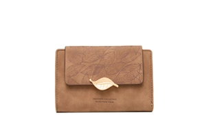Detail view of brown matte PU leather wallet with leaf print and gold leaf metal buckle