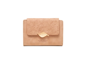 Detail of leaf buckle and vein embossed pattern on pink matte leather wallet