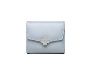 Close-up of blue textured faux leather wallet with gold clover clasp and neat stitching