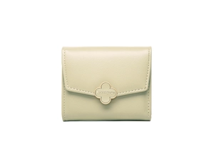 Detail of light green leather wallet with gold clover clasp and clear stitching