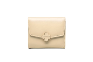 Detailed shot of beige compact wallet with golden clover buckle and fine leather texture
