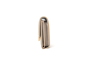 Side view of beige trifold wallet showing multiple internal compartments and card slots