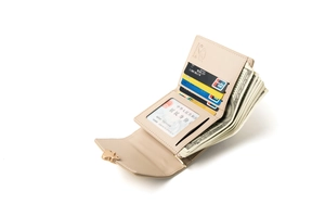 Detailed view of women's leather tri-fold wallet with heart buckle and multiple card slots