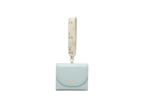 Close-up of light blue short wallet featuring gold logo and floral patterned wrist strap