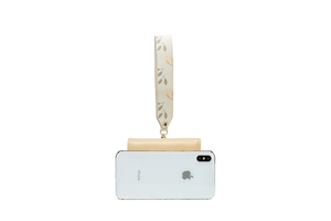 Minimalist beige short wallet with leaf pattern wrist strap shown next to a smartphone
