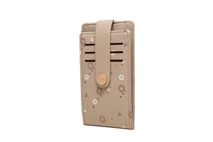 Close-up of a light brown floral card holder with gold snap button and multi-card slots