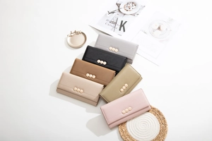 Detailed top view of long trifold wallets in six colors with gold buckle accents