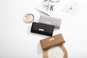 Detailed view of long PU leather wallets with leaf engraved gold buckles in three colors