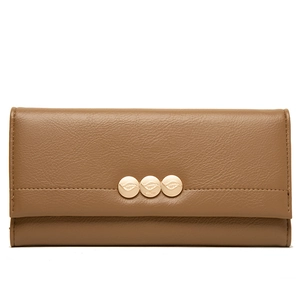 Detail of brown faux leather wallet with three gold leaf-engraved metallic buttons