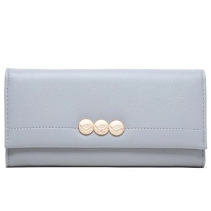 Detail of light blue long leather wallet featuring gold leaf metal charms on the flap