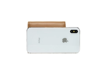 Brown litchi leather wallet size comparison with a smartphone on white background