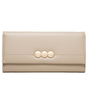 Detail of beige faux leather wallet featuring golden leaf-embossed metal snaps
