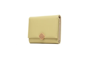 Macro detail of avocado green tri-fold wallet showing fine stitching and rose gold buckle