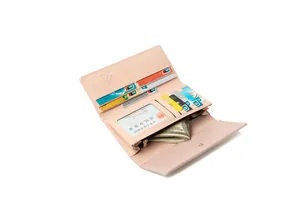 Interior detail of pink trifold wallet showing multiple card slots and zipper pocket