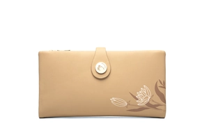 Detail of floral print and metallic snap closure on long beige PU leather wallet for women