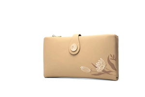 Detail view of beige floral wallet with litchi texture and golden buckle clasp