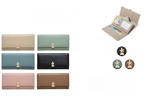 Detailed view of women's long wallet with card slots and golden leaf metal buckle
