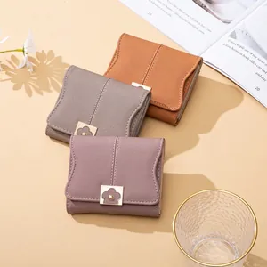 Short minimalist PU leather women's wallets in various colors with gold flower clasp