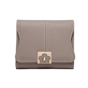 Close-up of taupe PU leather wallet with scallop edge flap and flower metal buckle