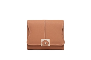 Detailed view of brown PU leather wallet featuring white stitching and floral metal buckle