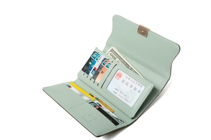 Detail view of mint green PU leather wallet with card slots and golden metal clasp